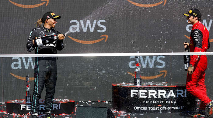 Lewis Hamilton and Carlos Sainz on the podium.